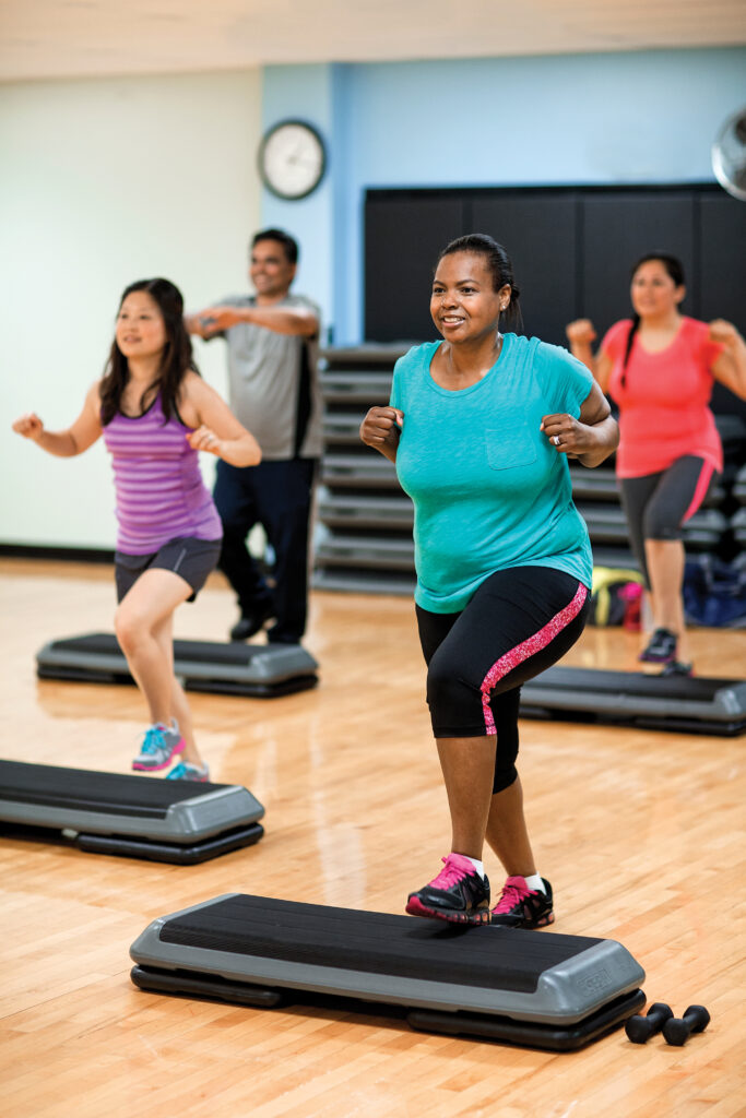 Active adults in a step aerobics class